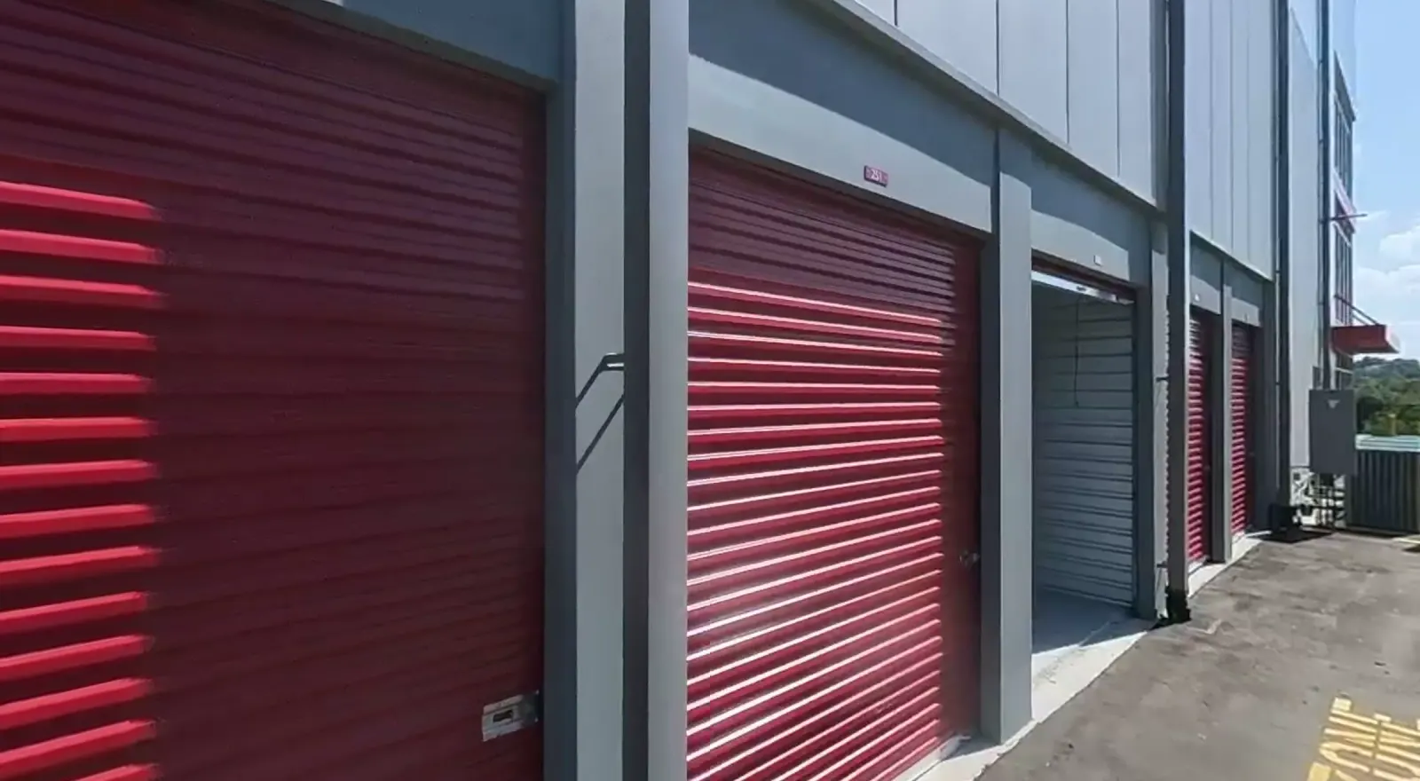 Exterior drive-up storage units with roll-up doors at Sunny Storage in Clermont, FL
